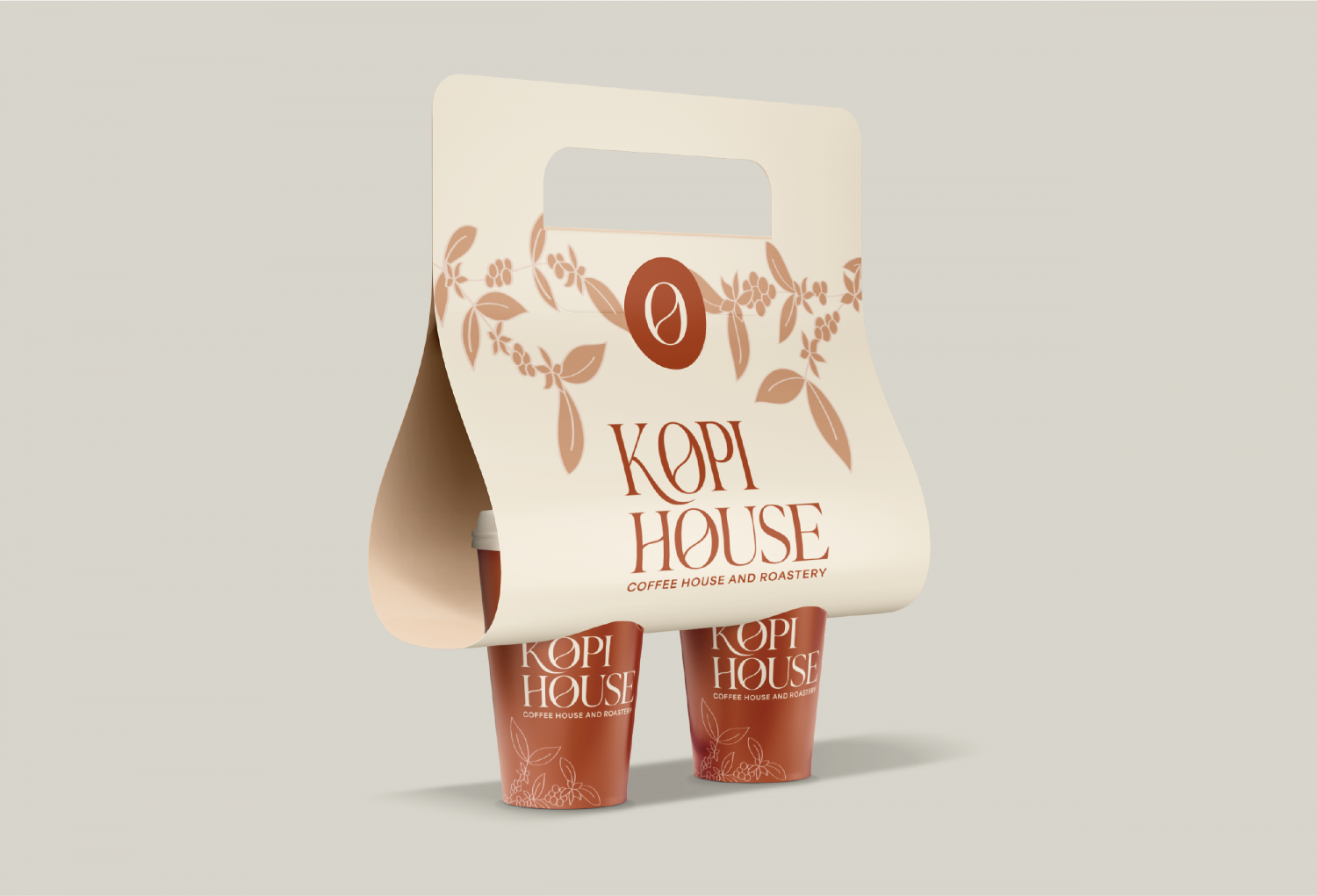 A disposable drink carrier that is holding two coffee cups. The coffee cup carrier features the brand’s logo ‘Kopi House’ and the slogan ‘coffee house and roastery’ on the front.